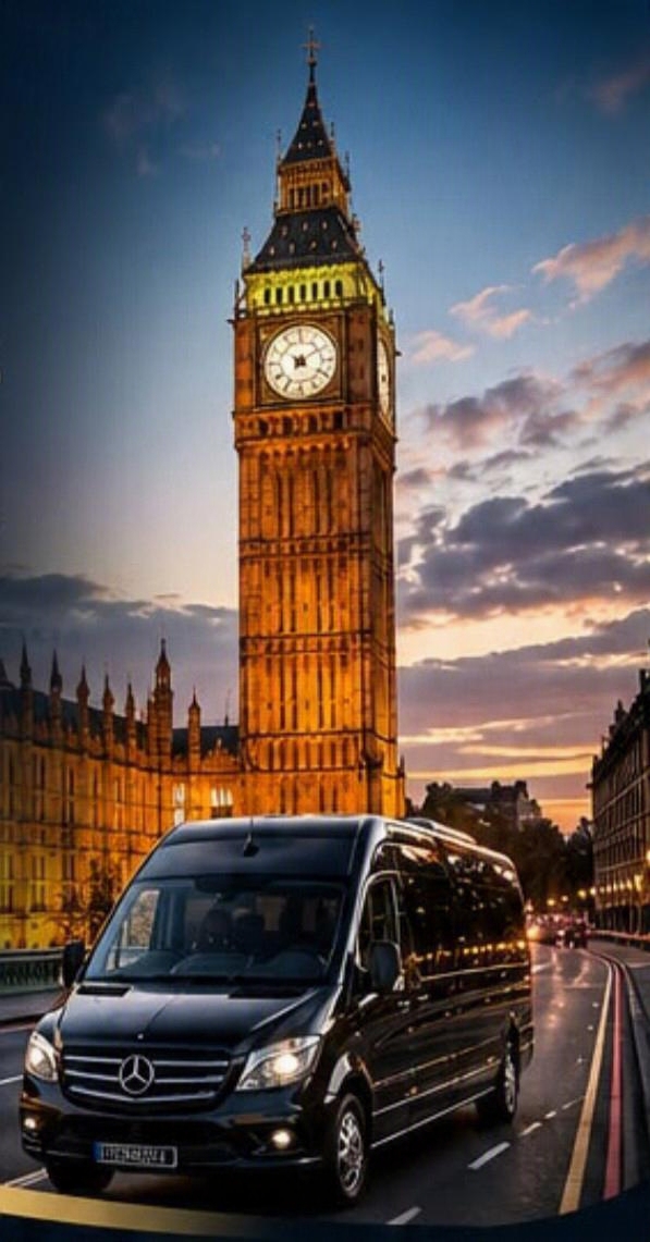 Black Mercedes-Benz minibus driving past Big Ben and the Houses of Parliament at dusk