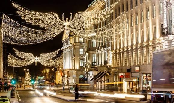 Regent Street Christmas angel lights illuminated above the road at night